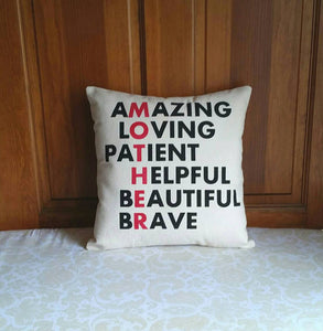 Mother anagram pillow leaning against a wooden door