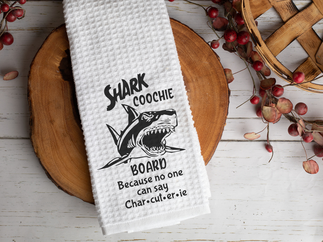 Shark Coochie Board Funny Charcuterie Pun Kitchen Towel, laying across a wooden slab decorated with fall berries 