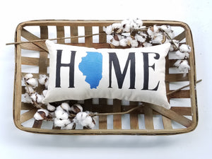 custom state home pillow in a woven basket decorated with cotton 