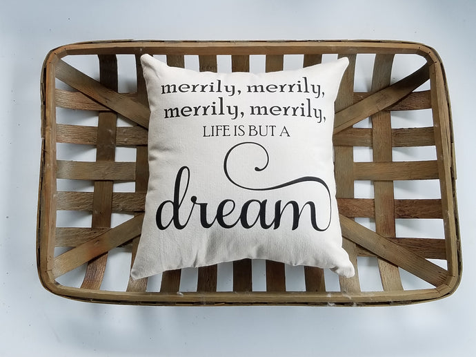 Merrily, merrily, life is but a dream | Nursery Decorations pillow sitting inside a woven basket