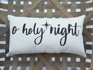 O Holy Night Christmas Pillow, against a woven basket background