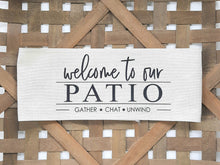 Welcome to our Patio Faux Burlap Off-White Pillow Wrap, laying in a woven basket