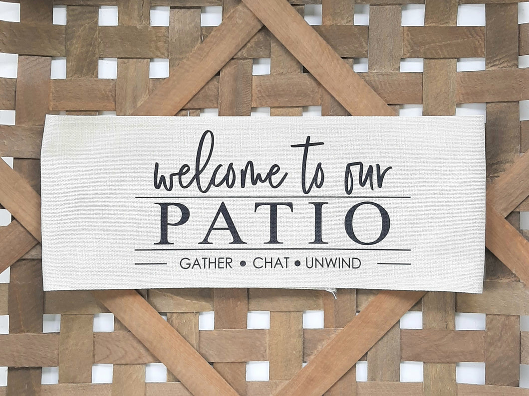 Welcome to our Patio Faux Burlap Off-White Pillow Wrap, laying in a woven basket