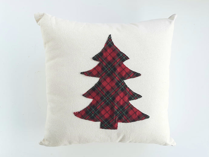 Flannel plaid Christmas tree pillow laying against a white background 
