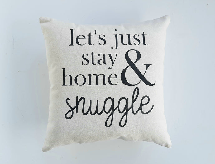 Let's Just Stay Home and Snuggle Pillow against a white background
