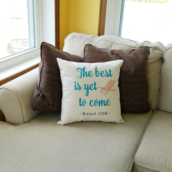 The best is yet to comes, customizable retirement date pillow, sitting on a couch 