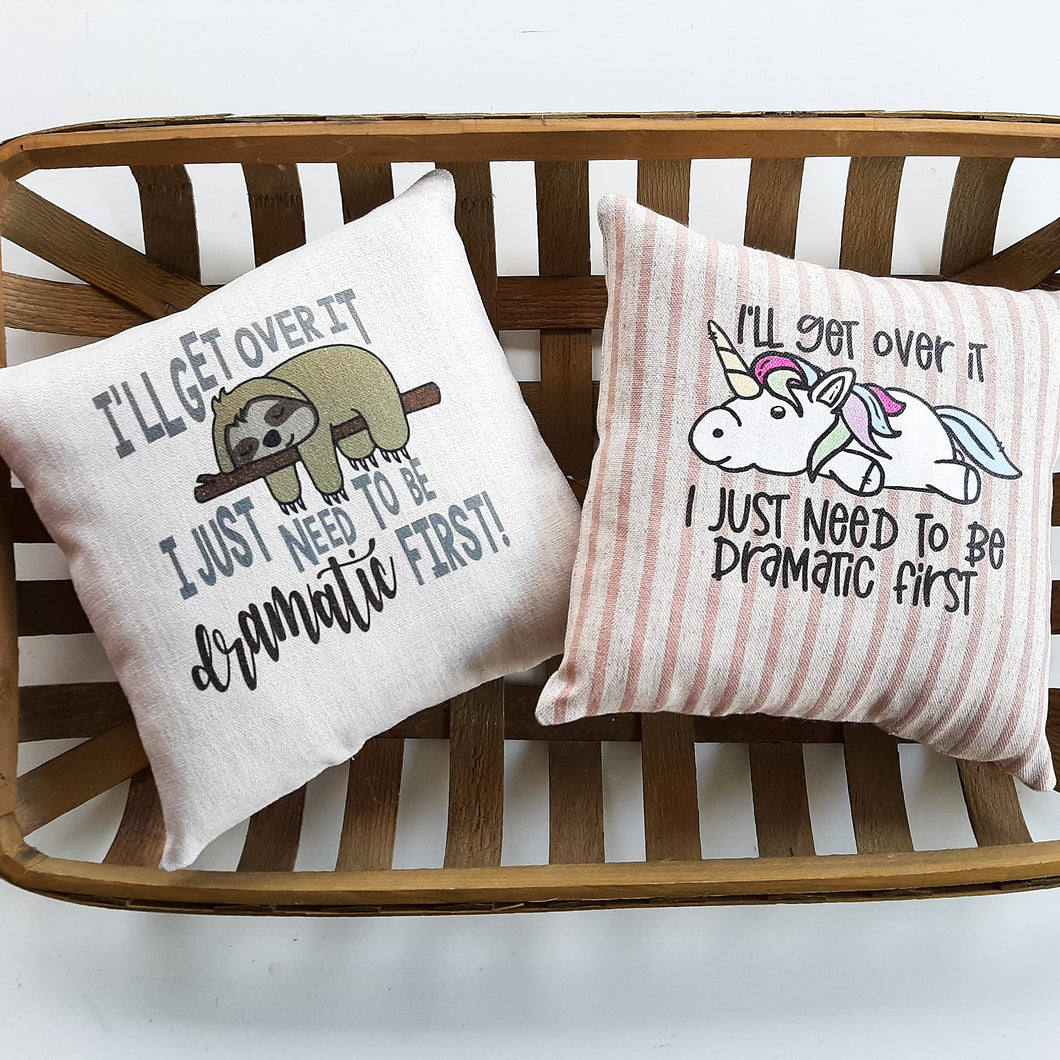 I'll get over it, I just need to be dramatic first Unicorn and Sloth Pillow both sitting inside a woven basket
