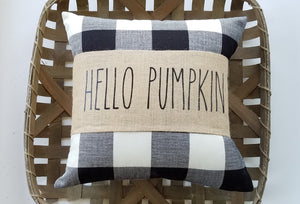 Hello Pumpkin Burlap Pillow Wrap with Buffalo Check Autumn Decor Pillow sitting inside a woven basket