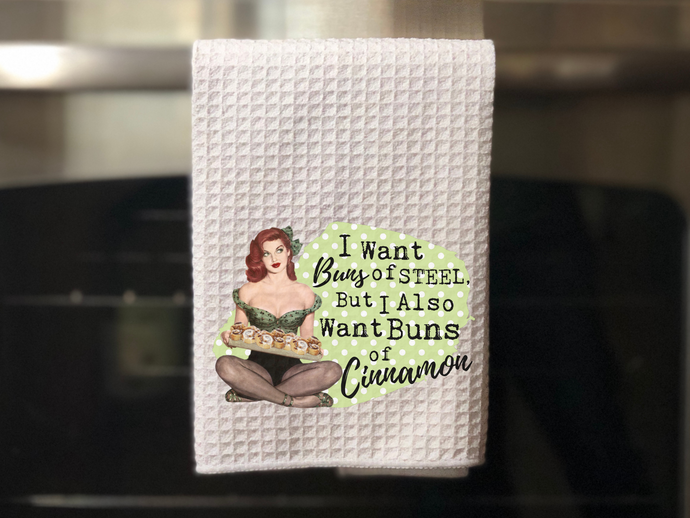 Retro Girl Funny Tea Towel, Buns of Cinnamon, hanging on an oven door