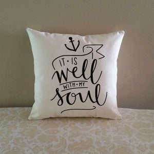 It is well with my soul | Hymn lyrics inspirational accent pillow leaning against a tan wall