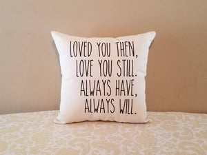 Loved You Then, Love You Still Farmhouse Pillow, leaning against a tan wall
