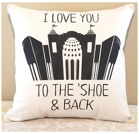 I love you to the Shoe and Back (Ohio state) pillow leaning against a tan wall